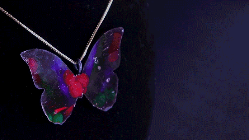 MorphoChrome butterfly pendant changing color with viewing angle